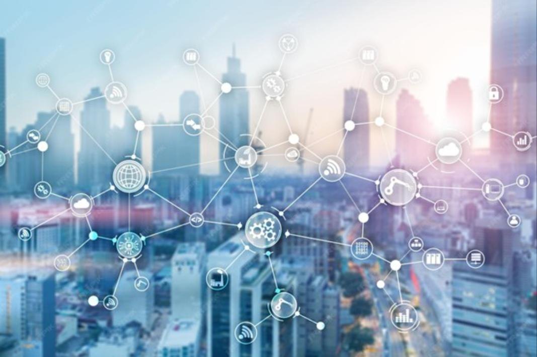 A city skyline overlaid with a network of connected device icons